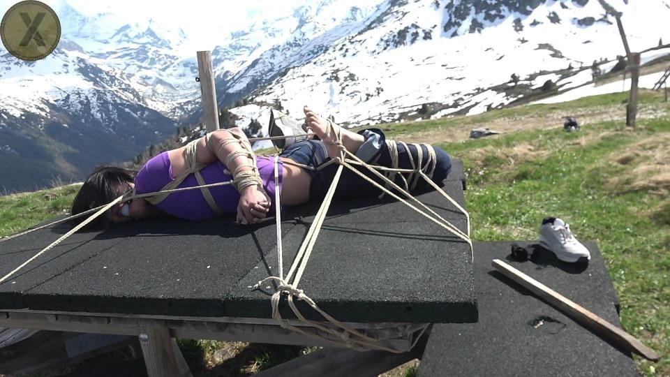 Enjoy The View Allie mp4 Full Clip Allie BowString from New Zealand met Sasori the first time in her life when she`s on vacation in Switzerland. He offers her to take her with his motocross bike to places in the Alpes where no tourist and only very few people at all ever been. Of course there's twist as he wants to tie her up if he shows her the impressive mountains. She agrees to this without thinking really about it or asking questions like when, where or how. Soon she learns that she should have asked and think better about it.<br><br><br>Once up on 2400 meter at the mountains he stops at a nice viewing point and tells her he want to tie her here and now, before she realise it, Sasori pulls out lots of ropes and starts tying her arms from wrists to biceps with thin hemp rope and tight cinches on several places. Then he tightly ties her upperarms with a chest harness to her body and places her on a table. Once ballgagged Sasori keeps adding more and more of the unforgiven thin hemp rope and her legs, frogtying and hogtying her. Now Allie gets worried when he starts tying her to this table in the middle of nowhere with only few empty wooden houses. He even bends her arms to one side, fixing them like this and removes one shoe and sock to tie her foot into the hogtie. After tyin the last knot on her exccessive bondage, he sit on his motorbike and drive away, further up the mountains and is gone. Allie is scared as she don't know him really at all and now she is totally fucked up and helpless, not evening knowing he will come back at all. Shouldn`t be long before the sun goes down and it gets freezing cold up there<br><br><br>Did this bastard told her "to enjoy the view"? Would he come back?<br><br><span style='color:#b0b0b0;'>[隐藏文字，购买后可见]</span>