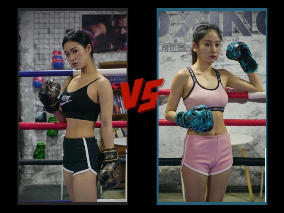 MF-FB20-Agan vs. Xi A female-fighter boxing match featuring punches to the abdomen and ring combat.