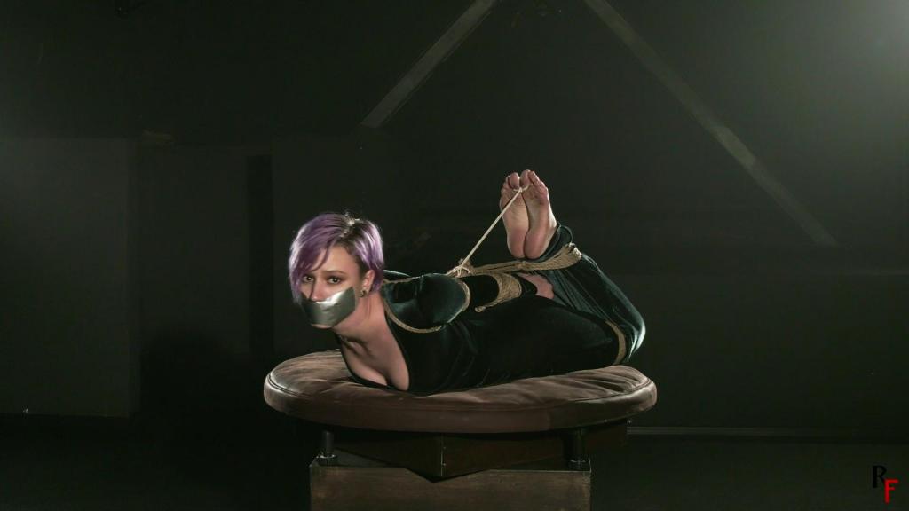 Snapshots from the clip with amazing Astrid in hogtie - Astrid wears a long green dress. The cutie is hogtied tightly on the turntable with a tapegag over her lips. Then she gets a big ballgag and then a cleave gag. Her cute big feet gets some bastinado, that Astrid really loves :D [驷马（俯卧）,Russian fetish]