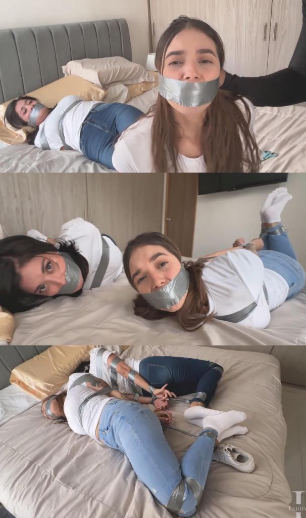 Simona is Not Answering, Luana Tries Looking for Her (Tight Jeans, White Shirt, White Socks, White S Simona is Not Answering, Luana Tries Looking for Her (Tight Jeans, White Shirt, White Socks, White Sneakers, Duct Tape, WrapGag, Hogtie, Bed)卢安娜一整天都在试图给西蒙娜打电话，但她一直没接。因为有西蒙娜家的备用钥匙，卢安娜决定去看看她。卢安娜敲了敲门，没人应答。她用钥匙开了门。看起来好像没人，但她还是决定进去看看。她来到卧室，发现西蒙娜被紧紧地绑在床上。<br><br>她穿着一件白色T恤，蓝色紧身牛仔裤，脚上穿着干净的白色短袜。她被胶带紧紧地捆绑着。她的手腕被紧紧地绑在背后，胸部上下和手臂也被胶带缠住。她的膝盖和脚踝也被紧紧地绑着，整个人被绑成了猪蹄状。她的嘴里塞满了袜子，并用胶带紧紧地封住了。<br><br>她看到卢安娜进来，开始更加用力地挣扎。她试图叫她逃跑，但她的哭声被闷住了，于是卢安娜走进房间想帮她。不幸的是，绑匪还在屋里，他悄悄靠近，从背后抓住卢安娜，用胶带把她的手腕紧紧地绑在背后，胸部上下和手臂也都被胶带缠住。然后，他从西蒙娜的梳妆台里拿出更多袜子，塞进卢安娜的嘴里，用胶带紧紧地封住她的嘴。他把卢安娜扔到床上，和西蒙娜躺在一起，继续捆绑她，用胶带绑住她的膝盖和脚踝，把她捆成猪蹄状，紧紧地绑在西蒙娜旁边。两人都被绑好后，他离开了房间，留下你们两个在那里挣扎。Luana has been trying to call Simona all day, but she isn't answering her phone.  She decided to go check on her since she has a spare key to her place.  Luana knocks on the door, but there's no answer.  She uses her key and let herself in.  It doesn't look like anyone is there, but she decides to check around anyway.  She gets to the bedroom and finds Simona tightly hogtied on the bed.<br><br> <br><br>She was also wearing a white tshirt with blue skinny jeans with plain, clean, all white ankle socks.  She's been tightly bound with duct tape.  Her wrists are tightly tied behind her back, as well as her torso above amd below her breasts and around her arms.  Her knees and ankles are also tightly taped and she's been put into a tight hogtie.  Her mouth is stuffed with socks and tightly taped shut with a wrap around tape gag.  <br><br> <br><br>She sees Luana enter and begins struggling even harder.  She's trying to tell her to run away, but her cries are muffled and instead, Luana enters the room to try to help her.  Unfortunately for therm both, her captor is still in the house and sneaks up and grabs her from behind and tightly tapes her wrists behind her back, as well as her torso above and below her breasts and around her arms.  Then he pulls out more socks that he found in Simona's dresser and stuffs Luana's mouth full and tightly tapes it shut with a wrap around tape gag.  He tosses Luana on the bed with Simona and continues to tie her up by taping her knees and ankles and putting her into a tight hogtie right next to Simona.  With you both bound, he leaves the room and leaves you both there to struggle.