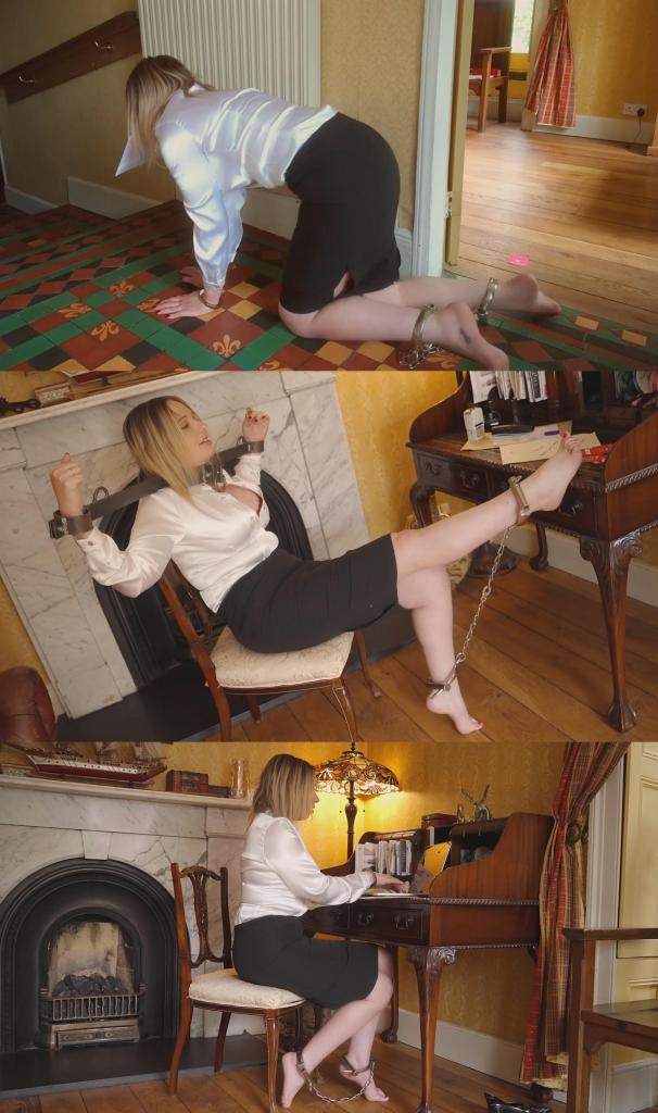 Epiphany Jones: Day In The Life Of A Secretary (VID1046) 艾皮法尼·琼斯小姐热爱她的工作。每天，她都精神抖擞地来到BDSM公司的办公室。她的老板，也就是首席执行官，制定的每日例行程序的第一件事就是脱鞋——在这栋楼里，秘书们总是光着脚。当然，她穿着公司规定的白色缎面衬衫，总是敞开着，露出性感内衣的一角。铅笔裙紧得让她几乎寸步难行。不过这也没什么，因为每次去会议室，她都不能走路——她必须手脚并用地爬过去，双手被铐着，脚上还戴着沉重的金属脚镣。<br><br>今天，她的老板首先给她戴上了一个钢制的颈圈和手铐。尽管受到这些限制，她仍然必须优雅地完成工作——接电话、记录留言、整理办公室、为上午10点的董事会会议准备一份报告。然后，她被解开了枷锁，双手也被铐在身前，换成了铰链式手铐。她沿着走廊爬到会议室去送邮件。到了那里，她必须踮起脚尖站着，随时准备提供服务。Miss Epiphany Jones LOVES her job. Every day she arrives at the office of BDSM corp with a spring in her step. The first step in the daily routine set down by her boss, the CEO, is to slip off her shoes - in this building the secretaries are always barefoot. Of course she wears the regulation white satin blouse, always unbuttoned to show off her sexy lingerie just a peek. Pencil skirt so tight she can hardly walk. Which is fine, because whenever she has to go to the boardroom she isn't allowed to walk anyway - she has to crawl on her hands and knees, handcuffed and locked in heavy metal leg irons.<br><br>Today her boss starts off by fastening her in a steel yoke around her neck and wrists. She must do her duties gracefully despite the restrictions - answering the phone, taking messages, tidying the office, assembling a report for the board meeting at 10 am. Then she's released from the yoke and her hands and cuffed in front of her instead in hinged handcuffs. She crawls along the corridor to the boardroom to deliver the mail. Once there she is required to stand on tiptoes waiting in case her services are required. 