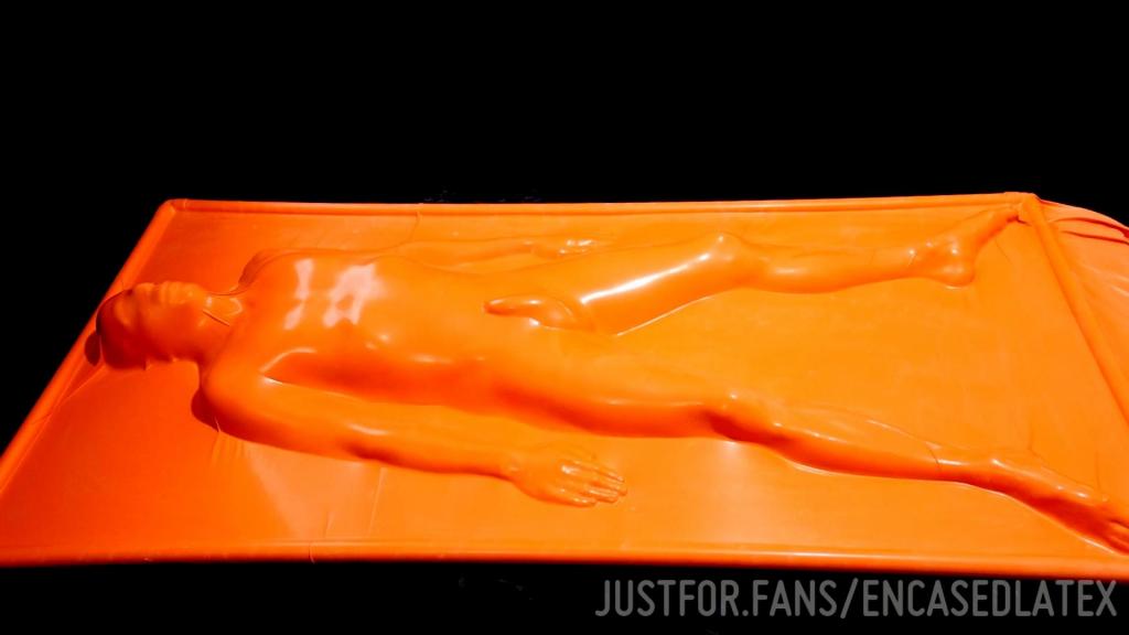 Sealed in tight orange latex 出自:encased<br>Sealed in tight orange latex<br>密封在紧密的橙色乳胶中