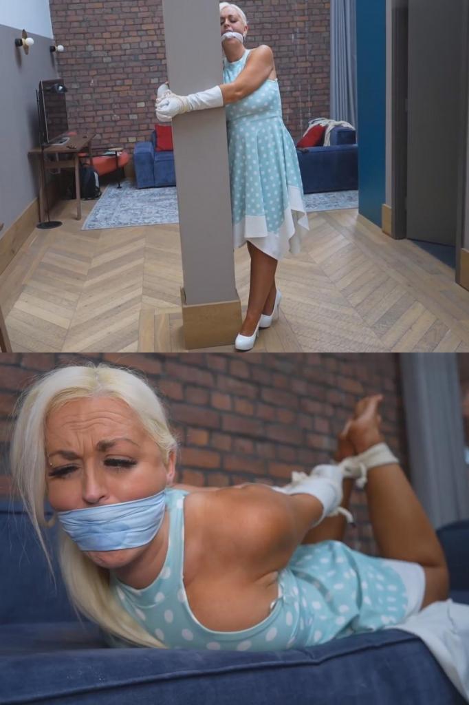 Blond milf cally, rockabilly babe nabbed. Pillar, hogtied and knotted cleave gagged 卡莉是一位性感金发熟女，她被人抓住了。她被关在一间公寓里，发现自己被绑在一根柱子上。她穿着摇滚风的波点连衣裙，戴着白色长皮手套，脚踩白色高跟鞋，挣扎着，这时一个陌生人出现在她身后。他正在打电话，安排着什么。说完后，他掏出一条白手帕，塞进卡莉的嘴里。然后他又掏出一条更大的白手帕，在中间打了个结，拉到卡莉的嘴唇之间，收紧后绑在她脑后。男人随后离开，留下卡莉独自挣扎，她现在被绑在柱子上，嘴也被牢牢地堵住了。这种情况持续了一段时间。卡莉拼命挣扎，但无法挣脱。她踢掉高跟鞋，露出光着的脚和脚趾。过了一会儿，男人回来了，戏弄着卡莉。他解开了她手腕上的绳子，把她拖走了。接下来，我们看到卡莉被五花大绑地绑在沙发上，嘴里还塞着之前那条打结的手帕。她扭动挣扎，呜咽着，声音被手帕堵住。这时，男人再次出现在画面中，手里拿着另一条手帕。他把手帕折叠成一条宽阔的布条，紧紧地绑在卡莉的嘴上，让她无法动弹。然后，他留下卡莉独自一人，无助地被五花大绑地绑在沙发上。卡莉呜咽着，哭喊着，透过手帕的口塞发出声音。她布满皱纹的赤脚露了出来。她拉扯着绳子，试图挣脱束缚，但一切都是徒劳。她被堵住嘴的尖叫声无人理会，她也因此醒悟，接受了自己的命运。Cally is a sexy blonde MILF that has been nabbed. She's been held in an apartment and finds herself bound to a post. Wearing her rockabilly polka dot dress, long white leather gloves, and white high heels, she struggles as a stranger appears behind her. He's on the phone talking, making arrangements. After he is finished, he pulls out a white handkerchief and stuffs it into Callie's mouth. He then pulls out another larger white handkerchief and ties a knot in the middle, and pulls it between Callys lips, tightening it and tying it behind her head. The man then leaves Cally to struggle, now bound and firmly gagged to the post. This goes on for some time. Cally struggles but is unable to get free. She kicks of her high heels which exposes her bare feet and toes. After a while the man returns, teasing Cally. He unties her bound wrists and drags her away. We next see Cally hogtied on the sofa, still gagged with the same knotted handkerchief cleave gag that was put on her earlier. She squirms and struggles, mmphing through the gag. The man then enters the screen again with another handkerchief. He folds it over into a wider band and tightly ties an over-the-mouth gag over the mature lady's lips. He then leaves Cally to struggle again, totally helpless and hogtied on the sofa. Cally whimpers and cries through her gag. Her wrinkled bare feet are on show. Pulling on the ropes, she attempts to free herself but it is useless. Her Muffled screams fall on def ears as she awakes her fate