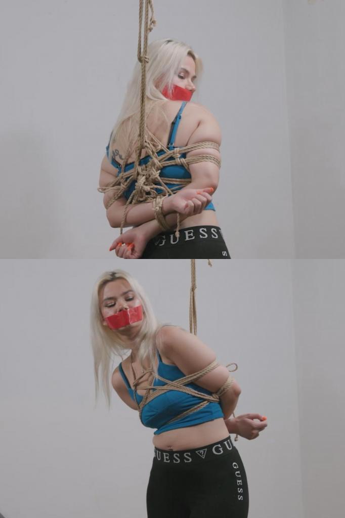 Tied and Taped: Rope Bondage and Tape Gagged starring Angelica 美丽的模特安吉莉卡·科拉尔维恩健身后回到家，还穿着运动服，却立刻发现自己被绑了起来，嘴巴也被胶带封住，这是为了给她“额外”的“锻炼”。她被绑成了经典的日式捆绑方式，嘴巴也被胶带封住，她唯一能做的就是在紧紧的束缚中扭动呻吟，享受挣扎和无助的快感。Beautiful model Angelica Coralvine comes home from her workout, still dressed in her gym clothes and immediately finds herself tied and taped gagged for an additional bit of exercise.  Tied in a classic Japanese bondage tie, her mouth taped, all she has left to do is squirm and moan in her tight bondage as she enjoys the struggle and the helplessness