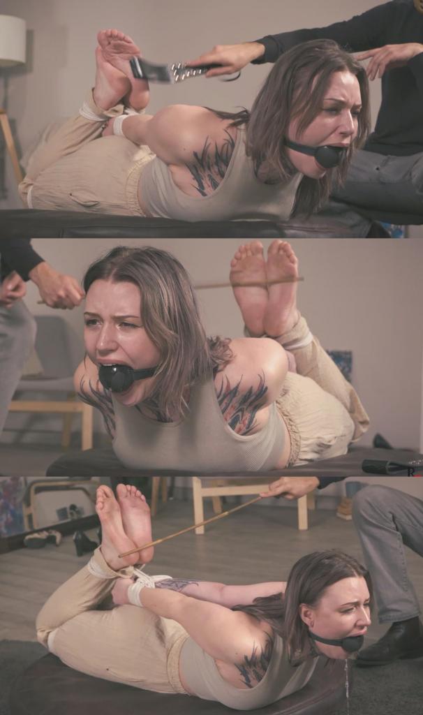 Astrid - Ball Gagged and Hogtied with Sweaty-Sole Bastinado by Bamboo Cane 在这段视频中，迷人的阿斯特丽德被紧紧地捆绑着，穿着匡威运动鞋，放在一个旋转台上，接受一场经典的足底鞭笞刑罚，重点是她的裸足。<br><br>场景开始时，一个巨大的球形口塞被塞进了阿斯特丽德的嘴里。随后，她的匡威鞋被脱掉，露出了她穿着运动鞋一段时间后温暖、汗津津、略带气味的大脚。<br><br>第一鞭打就落在了阿斯特丽德自己的匡威鞋上。之后，我把运动鞋放在一边，换成了木板，但只是短暂地使用了一下——这次刑罚的主要工具是一根竹竿。<br><br>接下来，视频呈现出一种简单却令人愉悦的节奏：阿斯特丽德裸露的脚底被狠狠地抽打了一轮，然后旋转台启动，她被紧紧捆绑的身体绕着轴心缓缓旋转。<br><br>镜头有足够的时间从各个角度捕捉她被捆绑的姿势、裸露的双脚、被塞住口塞的表情以及她的反应。<br><br>平台停止转动后，我再次拿起竹杖，又是一轮抽打。然后阿斯特丽德再次旋转，如此循环往复。<br><br>巨大的球形口塞撑开了她的嘴，让她口水直流。唾液顺着下巴流淌，随着转盘的持续旋转，在她周围形成一道清晰可见的圆形痕迹。<br><br>这段视频以视觉效果为主，融合了紧紧捆绑、脱掉匡威鞋、汗津津的赤脚、竹杖鞭笞、巨大的球形口塞、流口水以及旋转转盘的镜头。<br><br>敬请欣赏！In this clip, charming Astrid is tightly hogtied in her Converse sneakers and placed on a rotating turntable for a classic bastinado session focused on her bare soles.<br><br><br>The scene begins with a huge ball gag being secured in Astrid's mouth. Her Converse are then removed, revealing her warm, sweaty, slightly smelly big feet after spending time inside the sneakers.<br><br><br>The first strikes land with Astrid's own Converse. After that, I put the sneakers aside and switch to a paddle, but only briefly - the main instrument of this session is a bamboo cane.<br><br><br>From there, the clip follows a simple but very satisfying rhythm: Astrid receives a firm round of bastinado across her exposed soles, then the turntable is activated and slowly rotates her tightly bound body around its axis.<br><br><br>The camera gets plenty of time to capture her hogtie, bare feet, gagged expressions, and reactions from every possible angle.<br><br><br>Once the platform stops, I approach again with the bamboo cane and another round of strikes. Then Astrid spins once more before the cycle repeats.<br><br><br>The oversized ball gag stretches her mouth wide and gradually makes her drool. Saliva runs down her chin, and with the constant turntable rotation it creates a visible circular trail around her.<br><br><br>A visually focused clip combining tight hogtie bondage, Converse removal, sweaty bare feet, bamboo-cane bastinado, a huge ball gag, drooling, and rotating turntable views.<br><br><br>Enjoy!<br><br>