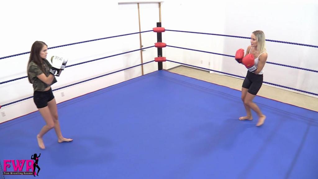 Boxing Babe Strip Down This custom video begins with an uninterested Becca in the boxing ring with Peyton. She’s bored of doing the same old boring boxing matches, then has an idea. She suggests that at the end of each round the cameraman (your humble producer) decides who won the round and then strips a piece of clothing off the loser. They continue until one of them can no longer continue. The bell rings and the punching begins! What follows is an over-the-top, eye-crossing, punch drunk, body twitching, limp play, eye checking, tongues hanging out, sexy clothing removal (to bikinis), multi-knockout boxing bash! The girls get increasingly dizzy and goofy as the match progresses and there are tons of fun visuals for you to enjoy. In the end, the two girls are knocking each other out simultaneously and falling in double sexy positions. Peyton finally outlasts Becca and wins the match, only to pass out on top of the blond. We think the real winner here is Rick, your humble producer, who got to strip the clothes off the girls! Enjoy this boxing babe strip down match!