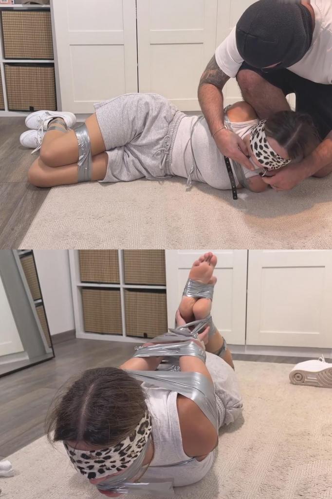 Tape hogtie hell - tickle, falaka, feet worship and sneaker self sniff 我被制服了，用灰色胶带捆绑起来。我的双手、手肘和手臂都被胶带缠住，躯干也被胶带缠绕。嘴里塞着一个白色的大球形口塞。他脱掉了我的耐克AF1运动鞋。我穿着黑灰色的袜子。他挠我痒痒，用马鞭抽了我几下。然后他把我的手脚绑在一起。他脱下一只袜子塞进我的嘴里。接着他用胶带缠住我的头。他舔我的脚，又挠我痒痒。还拍打我的脚底。他把我的鞋子压在我的鼻子上。最后，他脱下我的另一只袜子，把我的脚底绑起来。I am overpowered and bound with gray tape. My hands, elbows, and arms. Also around my torso. Gagged with a large white ball gag. He pulls off my Nike AF1 sneakers. I'm wearing black and gray socks. He tickles me and gives me a few lashes with the riding crop. Then he ties my hands to my feet. He pulls off one sock and stuffs it in my mouth. Then he wraps tape around my head. He licks my feet and tickles me again. Also slaps my soles. He presses my shoes against my nose. Finally, he pulls off my other sock and ties off my soles.